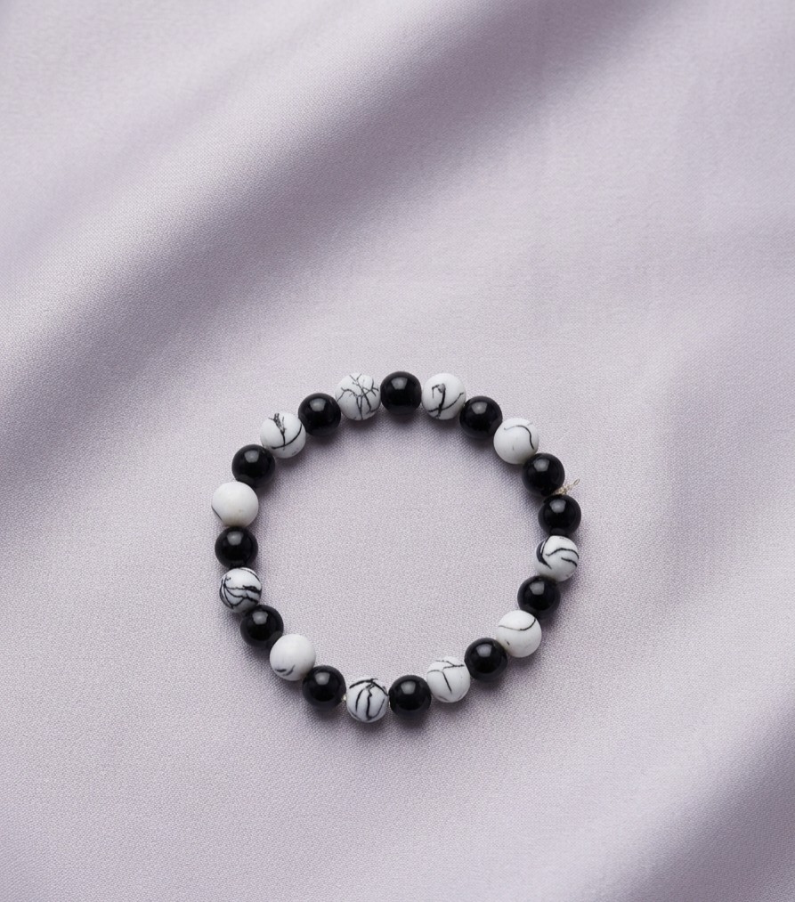Handcrafted White Beads Evil Eye Bracelet with Golden Spacers - Image 4